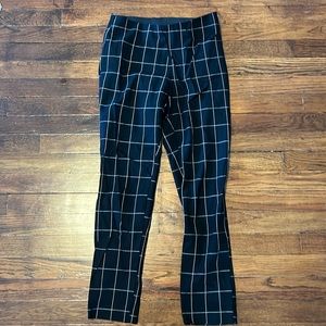Black and white checkered pants, stretchy materials, size 2 (but can fit size 4)